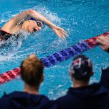 A transgender college swimmer is shattering records, sparking a debate over fairness