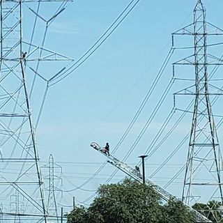 San Antonio police, firefighters bring man down from power line on Northeast Side