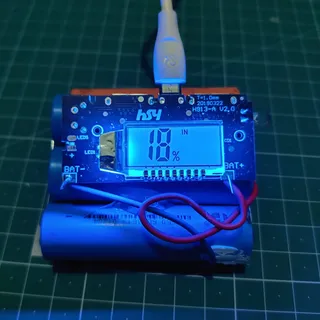 Make a dual power bank 1A/2.1A using 18650 Li-ion cells.