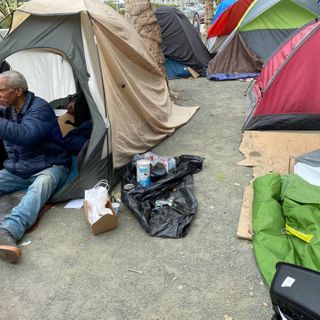 Cops roll into huge Civic Center homeless encampment — residents say they were forced to stay in tents during 'curfew'