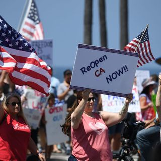 Unmasked Protesters Storm Huntington Beach After California Governor’s Closure