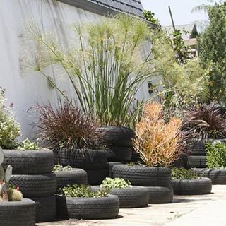 16 Landscaping Ideas With Tires – More Than Just Planters! | howtogardendesign.com