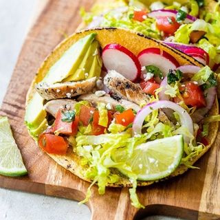 Grilled Chicken Tacos with Lettuce Slaw, Avocado and Cotija