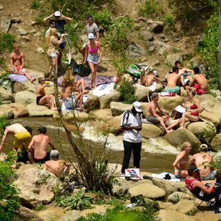 Hundreds gather along Boulder Creek prompting warnings from health officials