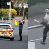 Two cops injured after being chased down street with a chainsaw