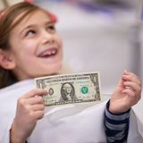 Parents explain why tooth fairy's putting 379% more money under kids' pillows today than 25 year ago