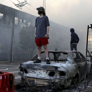 George Floyd protesters set Minneapolis police station afire