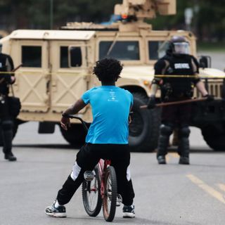 Alarmed Minneapolis Protesters Meet National Guard with Racist Past