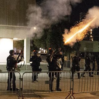 Vandals smash windows at end of night of protests over deaths of George Floyd, Dion Johnson