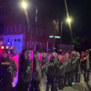 Police deploy pepper spray on protestors in Greensboro, stand in riot gear on Elm Street