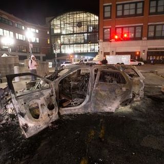 Demonstrators converge in Providence overnight, looting stores and setting a police car on fire; 65 arrested - The Boston Globe