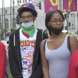 Group of young protesters represent their South L.A. neighborhood during demonstrations in front of City Hall