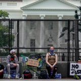 White House almost completely surrounded by more than a mile of fencing