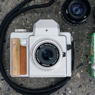 The Nons SL645 is an Interchangeable Lens SLR Instax Mini Film Camera