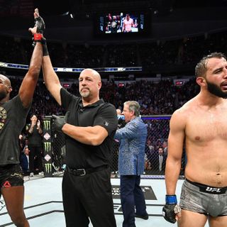 Jon Jones pressured by Dominick Reyes but pulls off another record-setting win