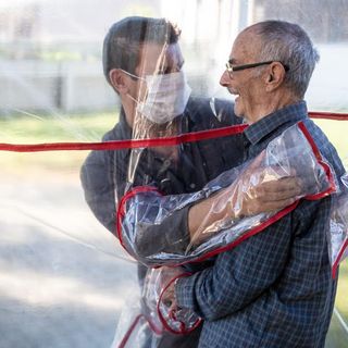 Brazilian care home creates 'hug tunnel' so loved ones can embrace elderly relatives | CNN