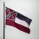 Mississippi furls state flag with Confederate emblem after 126 years