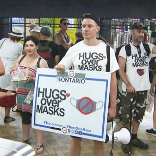 Protesters ride TTC without masks to call for an end to mandatory face coverings in Toronto